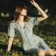 https //vgms.fanyu.com/ 编辑部主编林砚坐在靠窗书桌前比对多份公开资料文件并做批注的工作场景